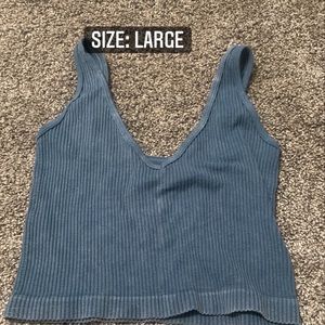 blue V necked crop top tight fit